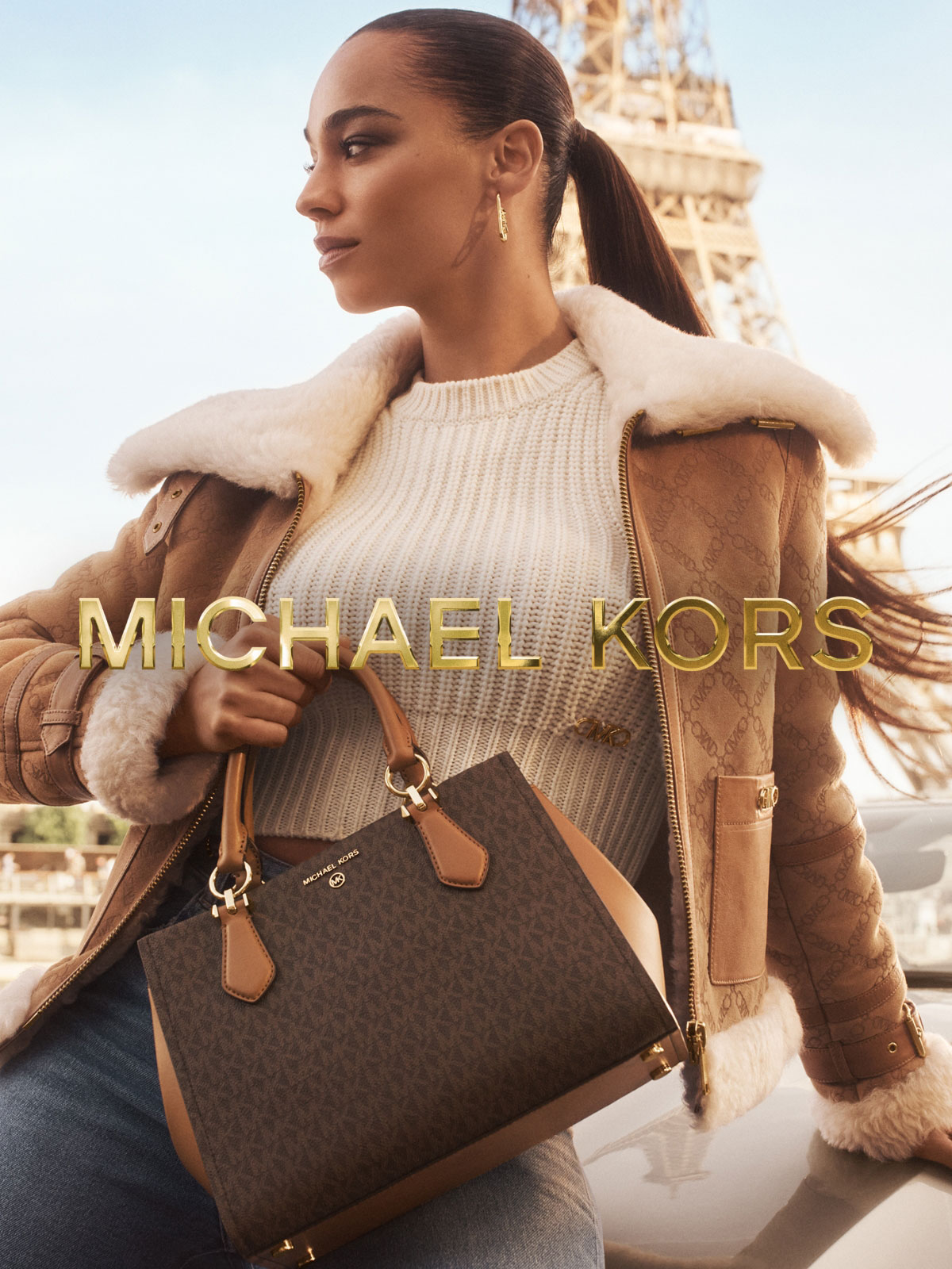 SIGNATURE MOVE Our iconic Signature Logo print makes its mark on the chic streets of Paris—and on our best-selling Marilyn satchel.