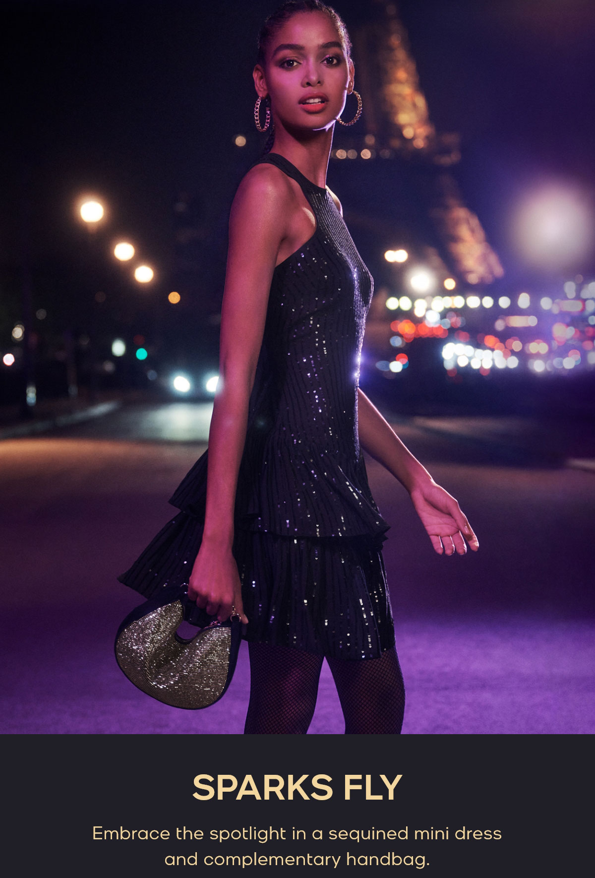 SPARKS FLY Embrace the spotlight in a sequined mini dress and complementary handbag.