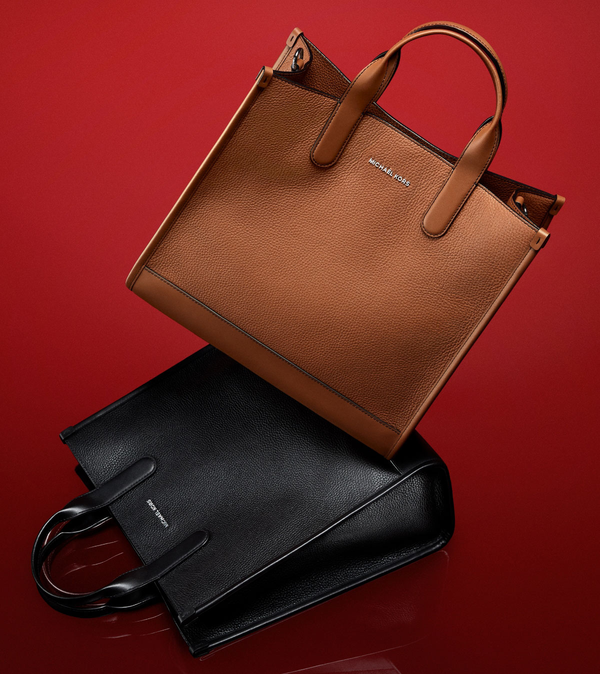 BAGGING RIGHTS Meet the season’s standout styles: a modern carryall for him and the chic Tribeca shoulder bag for her.