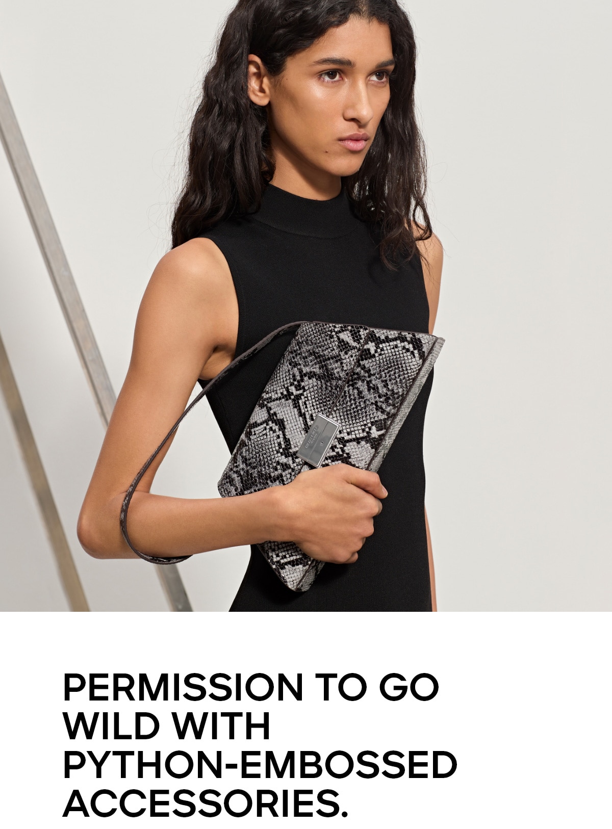PERMISSION TO GO WILD WITH PYTHON-EMBOSSED ACCESSORIES.